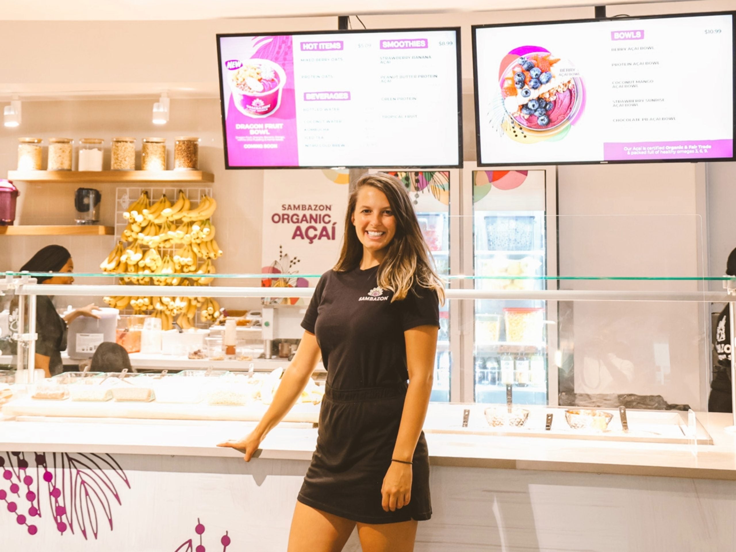 Image of Amanda Friedman standing in front of the service counter at Sambazon.