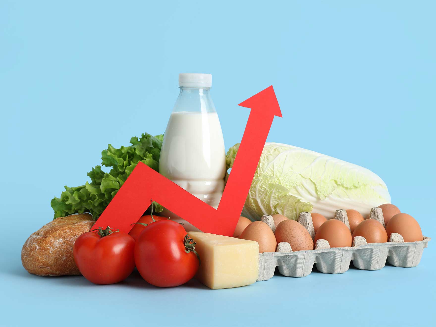 A red line amid a collection of groceries shoots up, representing rising prices.