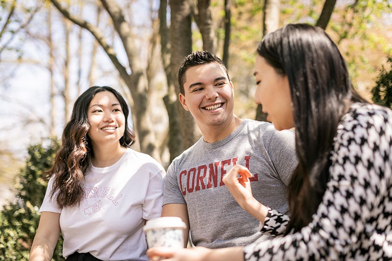MBA students outside in springtime.