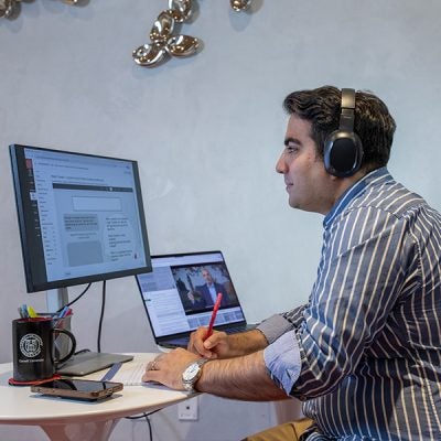 EMBA Americas student taking classes from home.