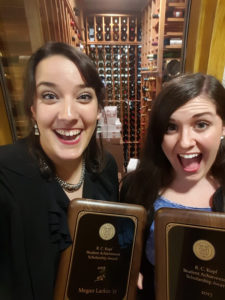 Photograph of Megan Larkin '17 and Cayley Boirrre '17, holding their R.C. Kopf Student Achievement Awards 