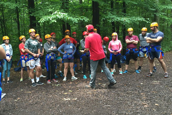 The Class of 2019 Park Leadership Fellows listen to instructions at the Hoffman Challenge Course.