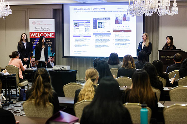 Christina Luniewicz, Claire Pen, Sarah Nicholson, and Amy Tran pitch their stock advice in front of peers and finance and investment experts.
