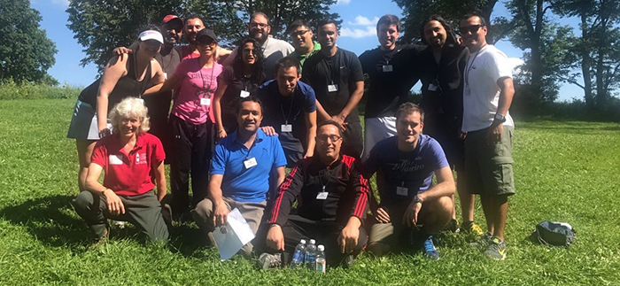 Photo of Team Mississauga and Team Lima-Santiago at Cornell's Hoffman Challenge Course