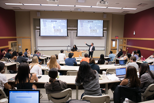 Photo of Damian Mogavero presenting during a Hotel School class