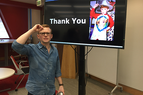 Photo of Jim Andretta posing next to his REDtalks presentation screen that reads thank you