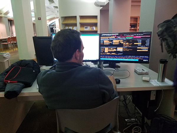 Photo of a teammate using the Bloomberg terminal computer program