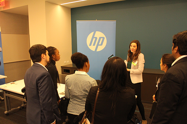 Photo of a women from HP talking to students