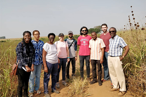 Photo of the SMART Uganda team with owners of Mukumu
