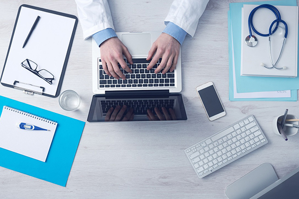 Photo of a healthcare professional on a computer