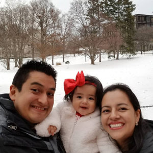 Photo of Carlos, Abby, and Cynthia in the snow on campus