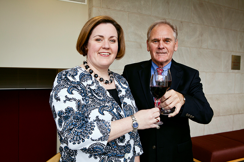 Photo of Stanley and Mutkoski toasting wine