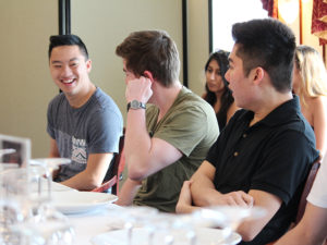 Photo of three students sitting at a table