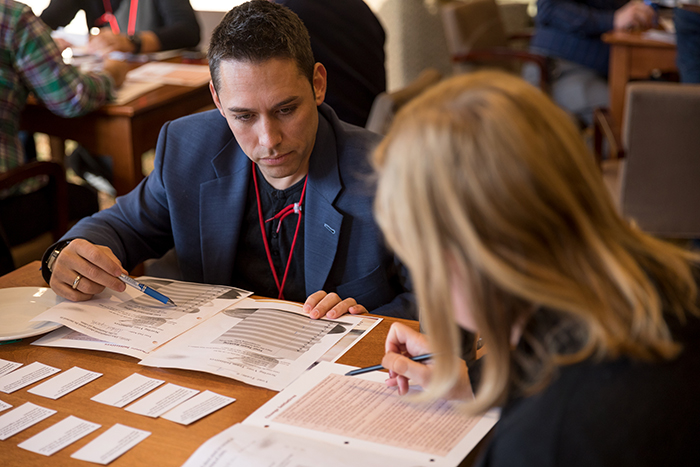 Photo of two participants working around a table