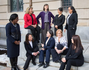 Photo of current women faculty and staff outside Warren Hall