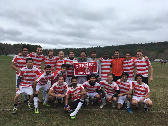 Photo of the soccer team wearing red and white stripes jerseys