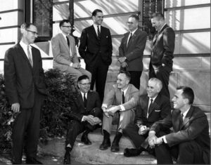 Black and white photo of men standing outside Warren Hall in the 60s