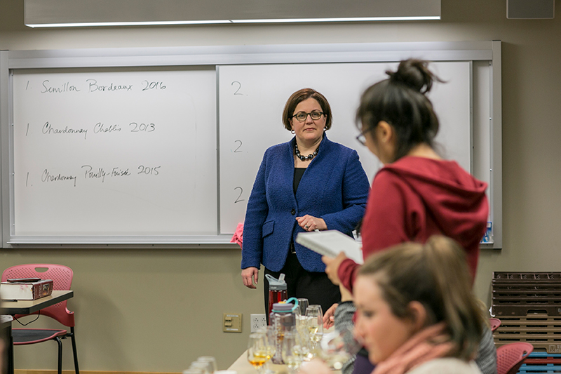 Photo of Margaret standing among other students