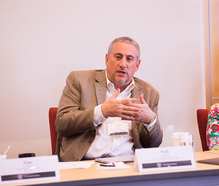Photo of Neil Tarallo speaking at a roundtable