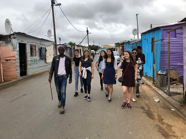 Photo of students walking through the village