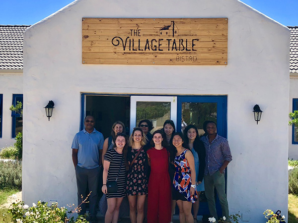 Photo of the group at the entrance to the restaurant