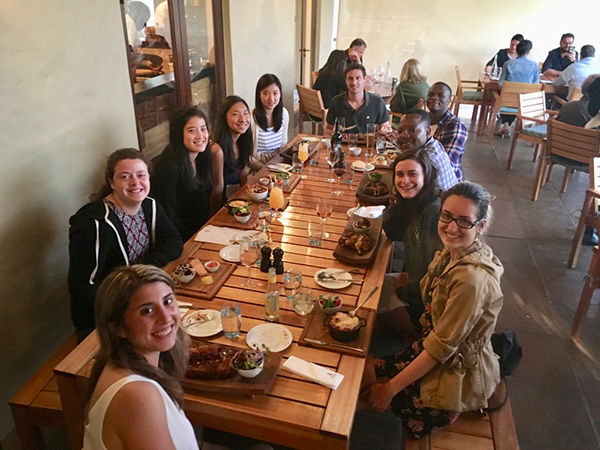 Photo of students sitting around a table