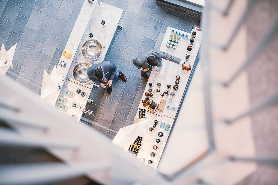 Photo of two men working at a food table from above