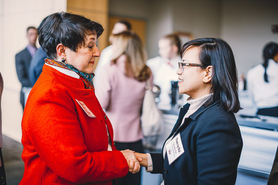 Photo of two women shaking hands