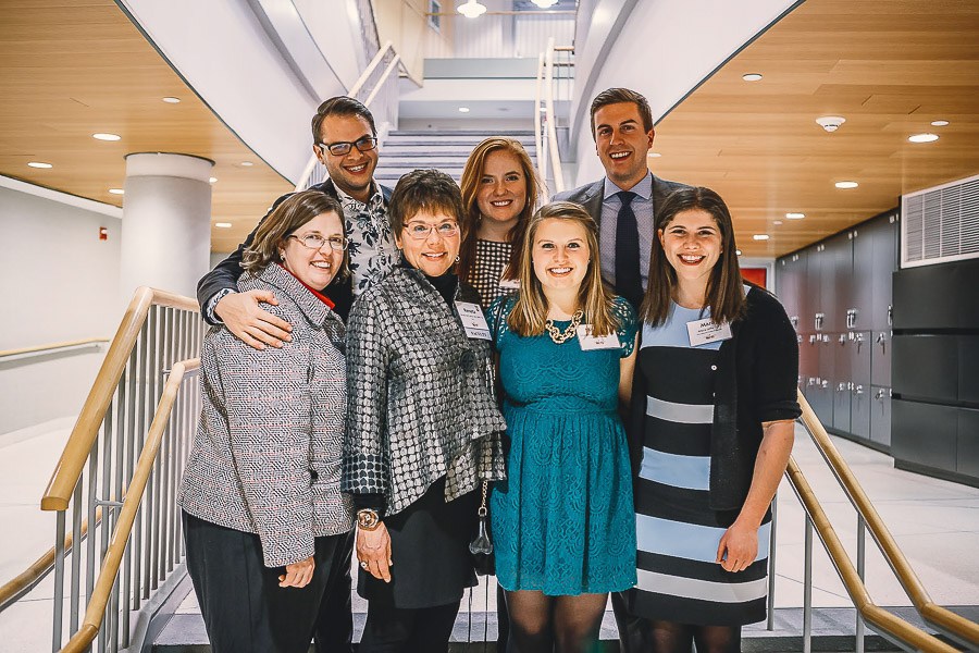 Photo of a group of faculty and students standing in a stairway