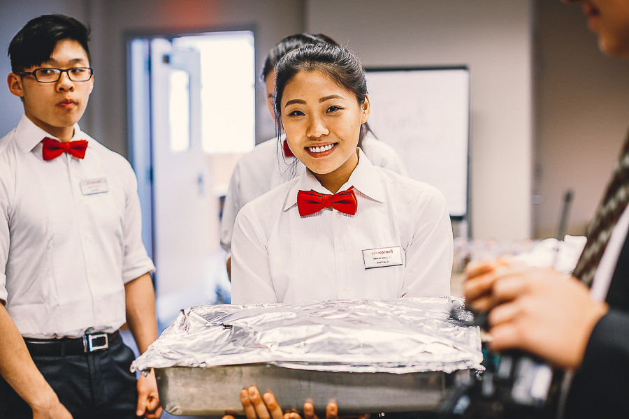 Photo of a girl carrying a tray