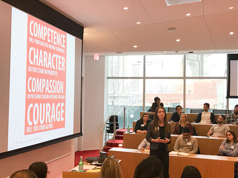 Photo of Laura Georgianna speaking in a classroom