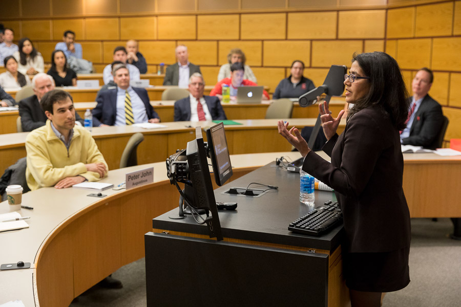 Photo of Anita presenting to a room of event attendees