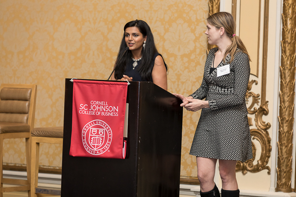 Photo of two women standing at a podium