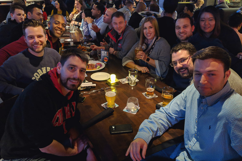 Photo of a group of people sitting around a table