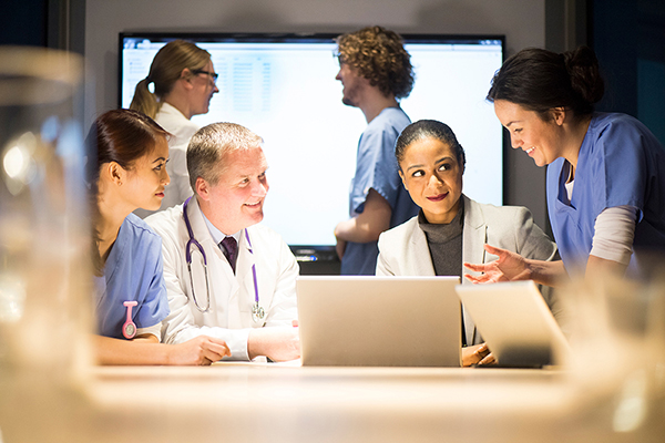 Photo of healthcare professionals collaborating around a table