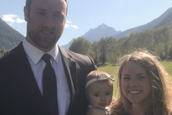 Photo of Max and his family standing outside