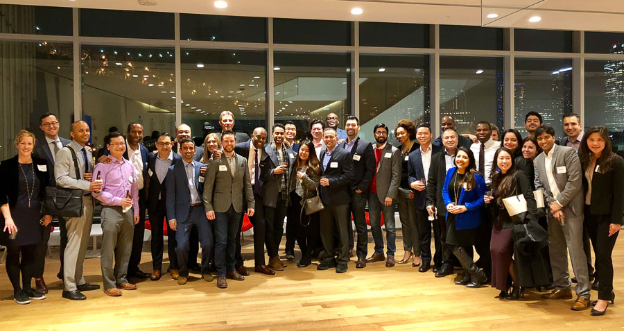 Group photo of the cohort with a skyline in the background