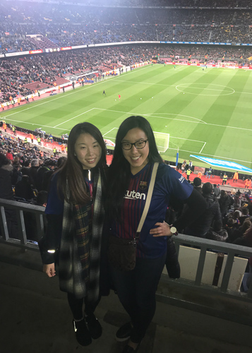 Photo of Nicole and a classmate with a soccer field in the background