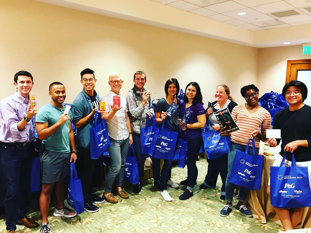 Photo of Brian and 9 other people with bags.