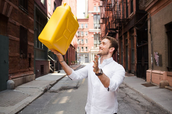 Photo of Antony tossing a water container