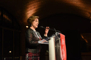 Photo of Anne at a podium