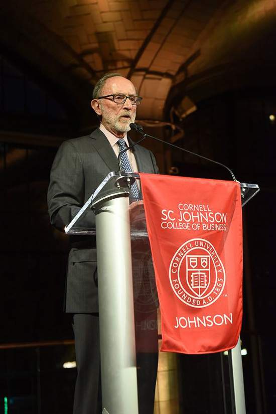 Photo of Hirschel at a podium