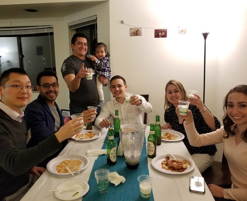 Students eating together in a current MBAs home