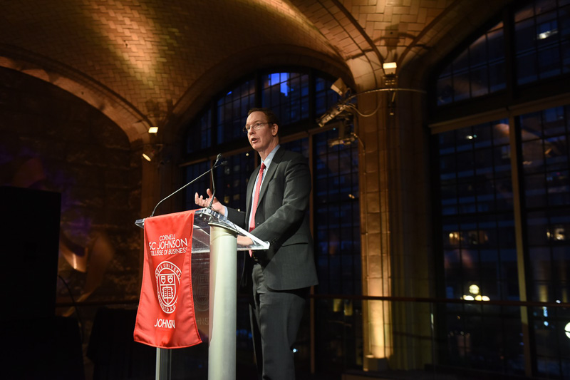 Photo of Dean Nelson at a podium