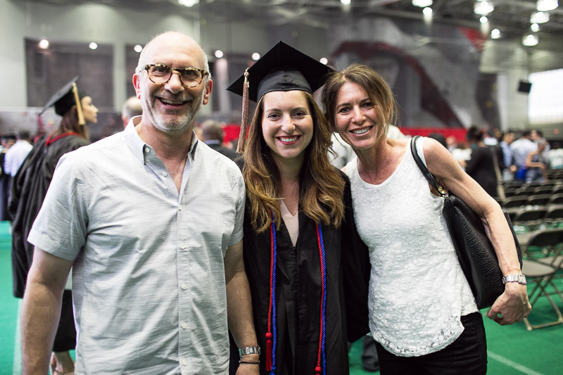 Photo of a graduate with her family