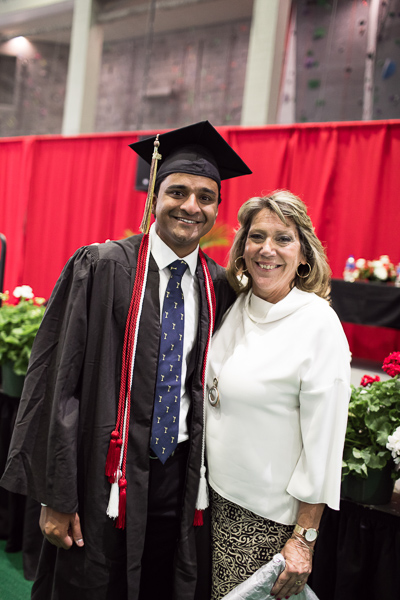 Photo of a graduate and Cindy van Es