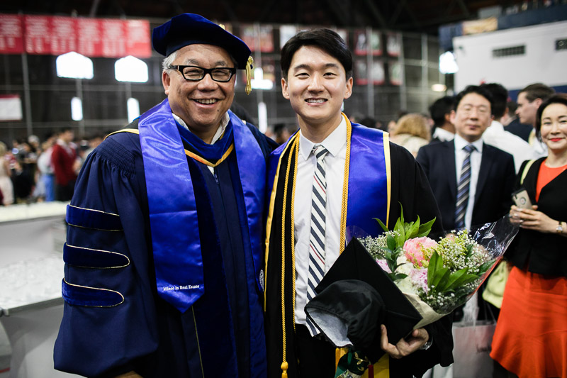 Photo of a graduate and faculty member