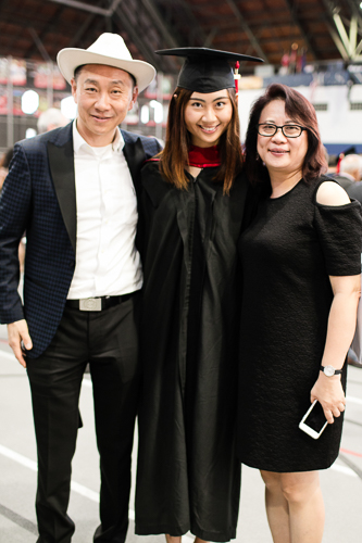 Photo of a graduate and her parents