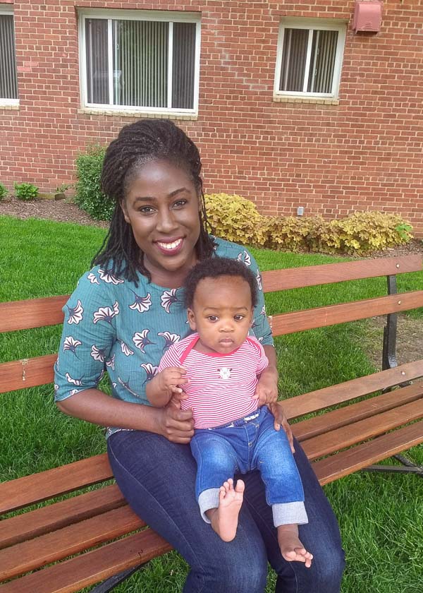 Photo of Gilda and her son sitting on a bench