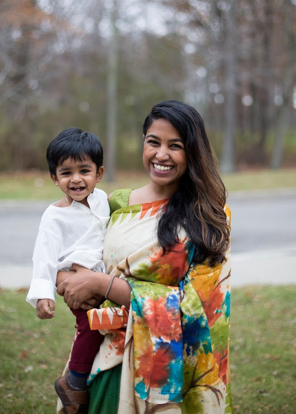 Photo of Karthika doling her son